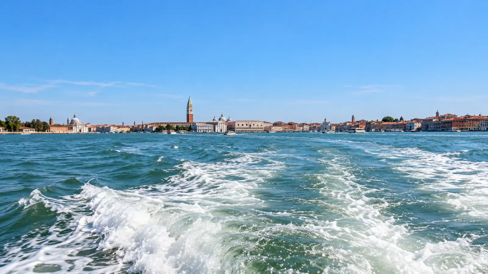 Venice skyline seen across the lagoon from the water.